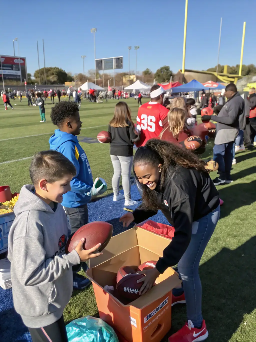 A group of volunteers and club members participating in a community outreach event, such as a rugby clinic for local schools or a fundraising activity for the club.